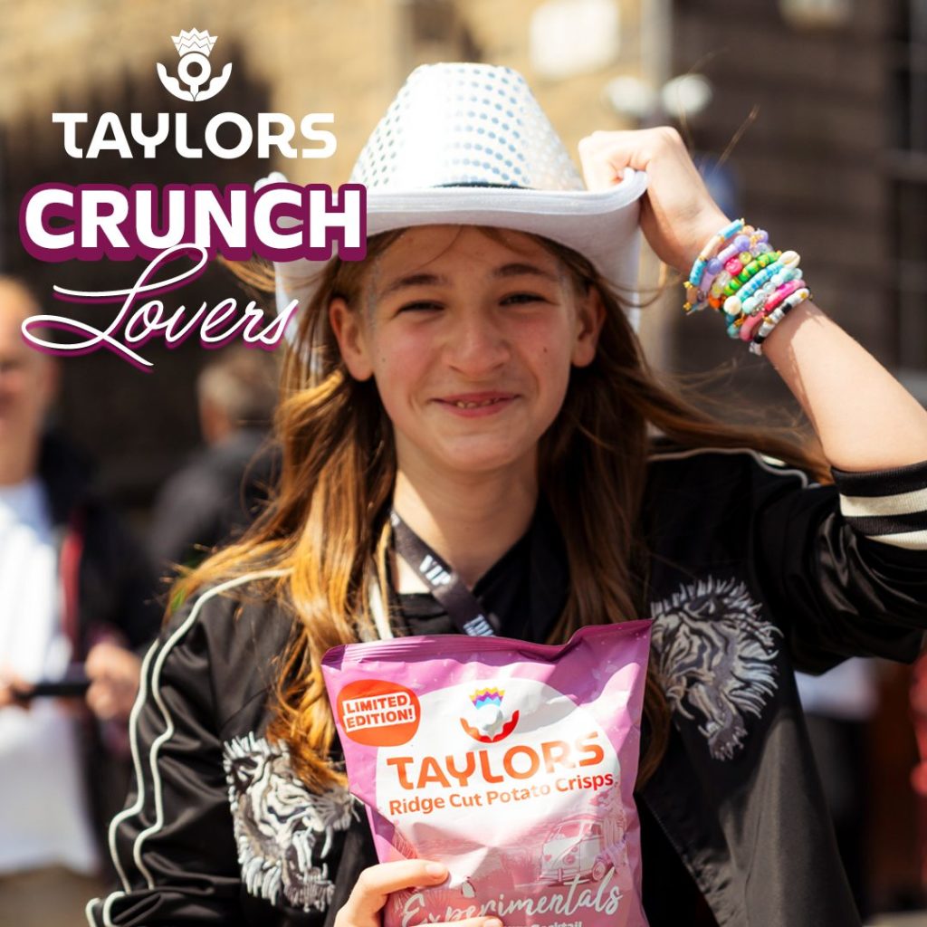 A Taylor Swift and Taylors Crisps fan with her packet of Experimentals crisps.